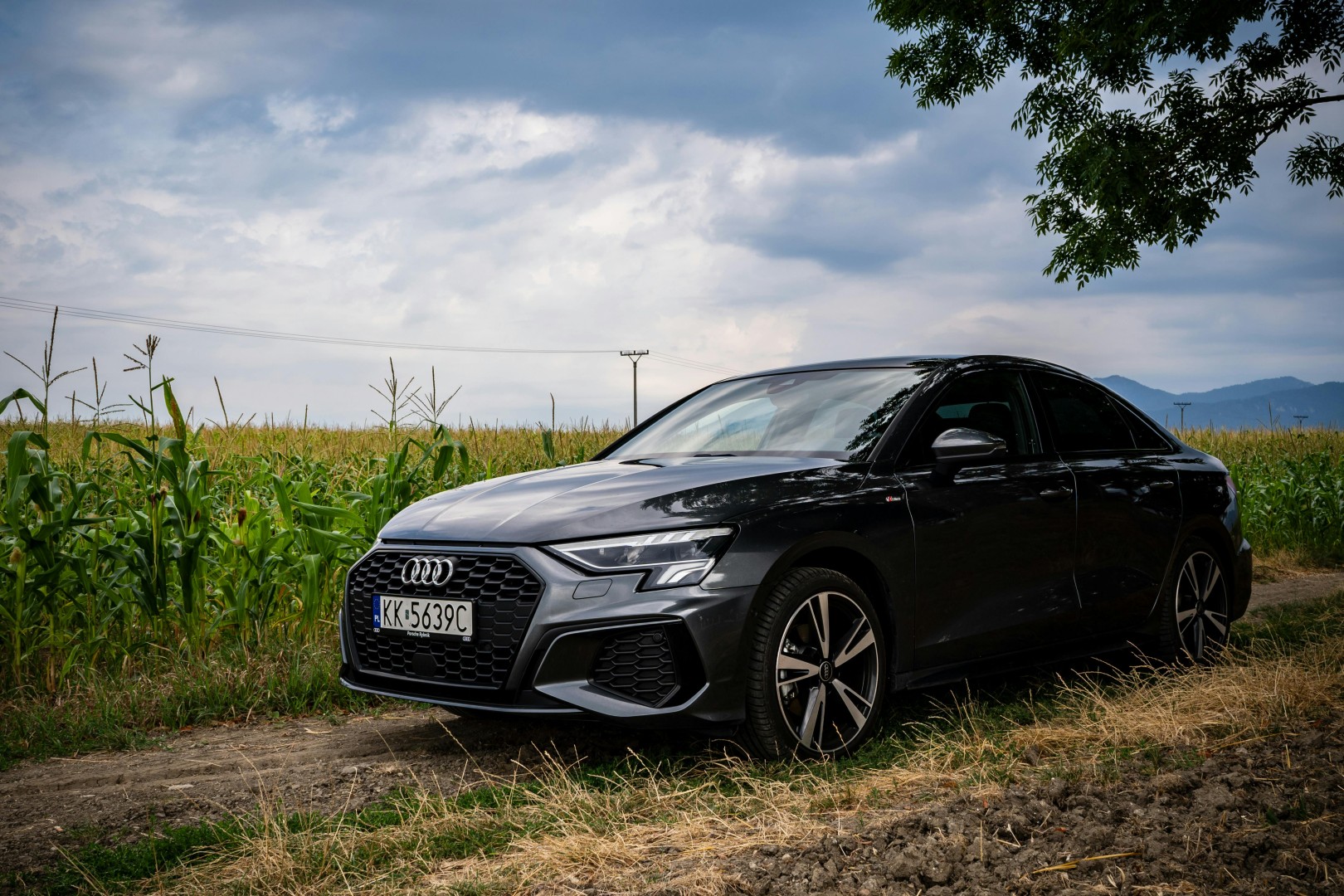 Audi A3 parked on a dirt road