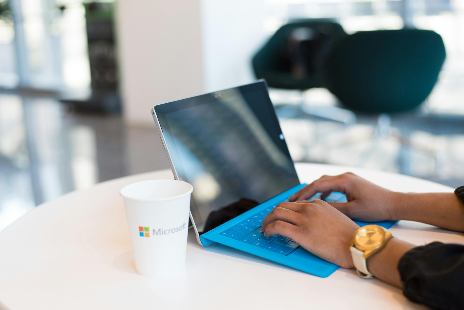Windows laptop and cup