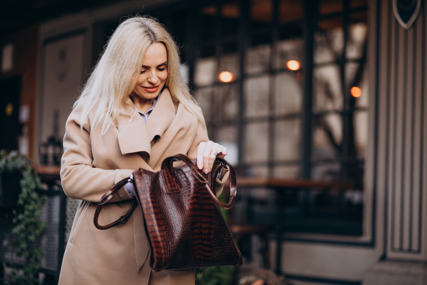elderly woman coat outside cafe