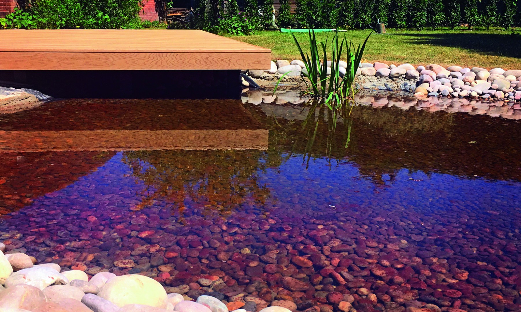 Landscaping a Natural Spa Pond with Oversail Deck