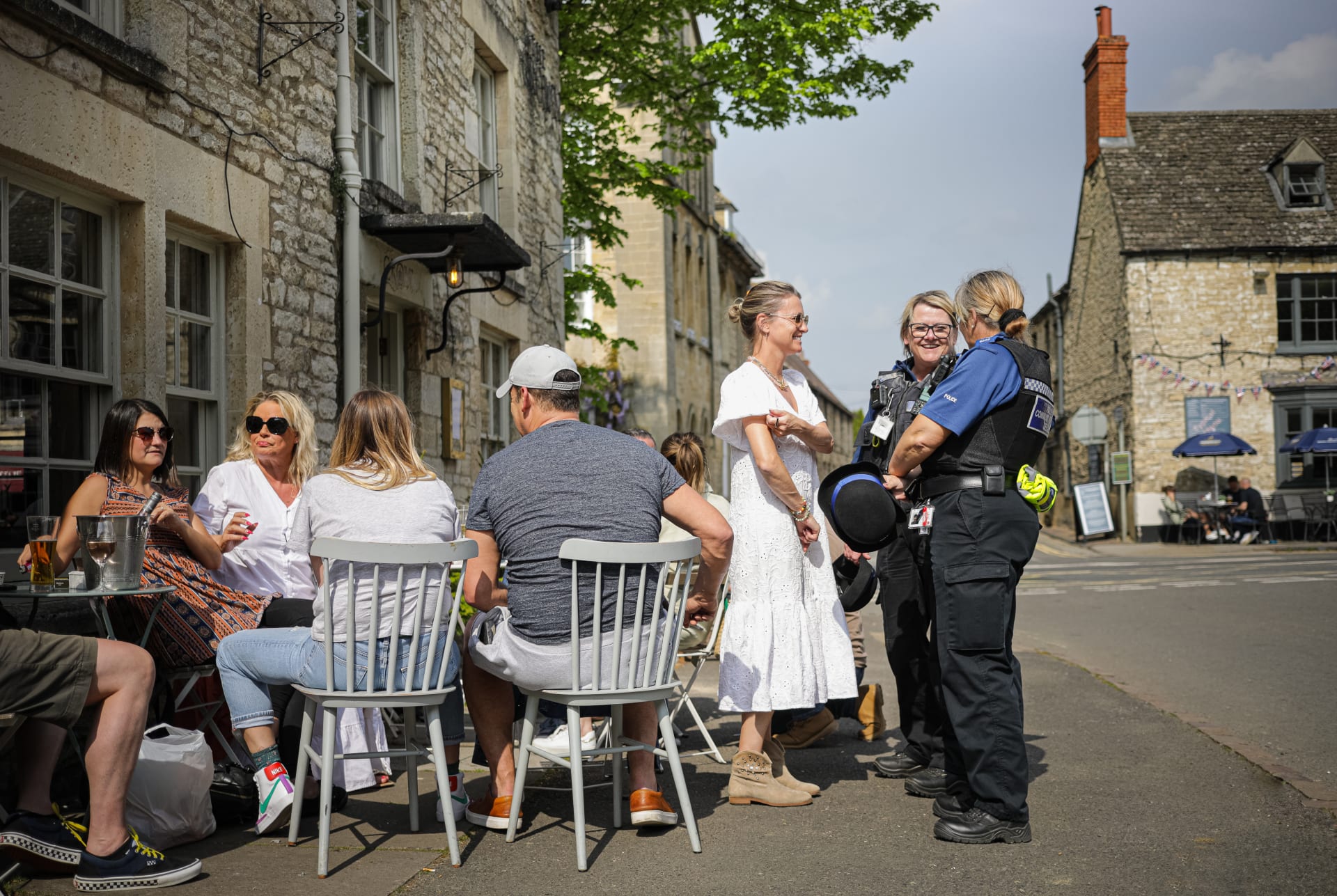 WUTW Lady talking happily to police officers outside The Punchbowl   Bokeh 8 1 wk768r