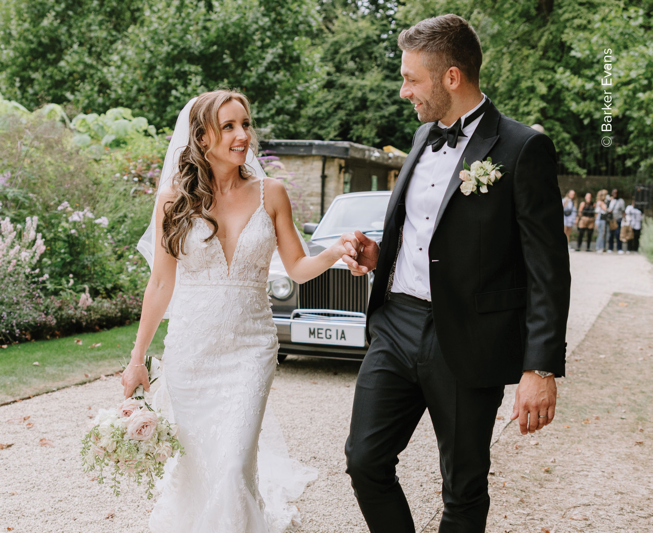 Wedding Couple in front of gate photo courtesy of Barker Evans Photography RH