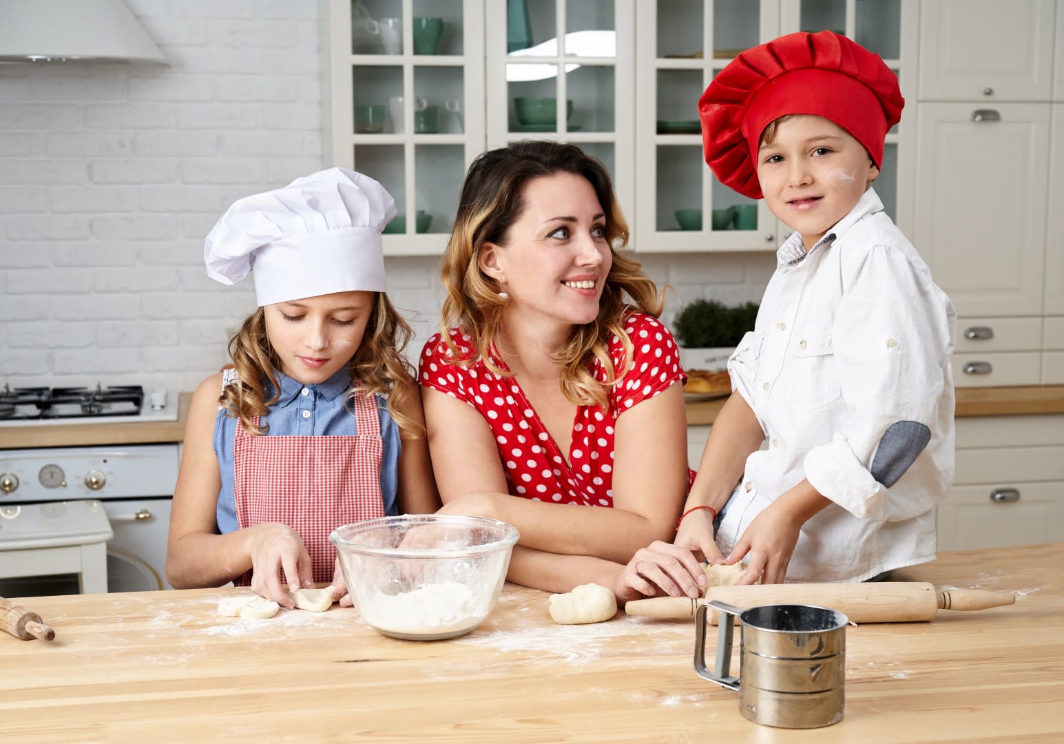 Mum Cooking With Her Young Children